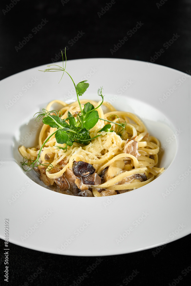 Creamy Mushroom and Cheese Pasta in Elegant White Plate on Black Background