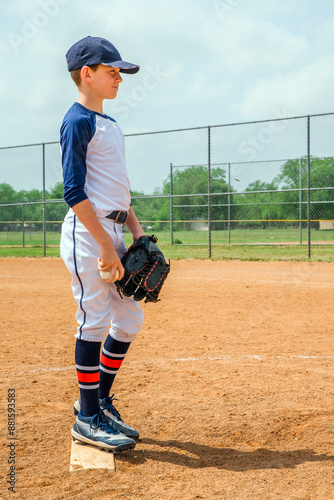Photography Youth male baseball player on the pitchers mound, ready to pitch a fastball