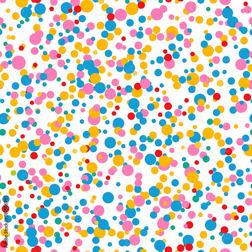 Seamless pattern featuring colorful confetti sprinkles scattered background