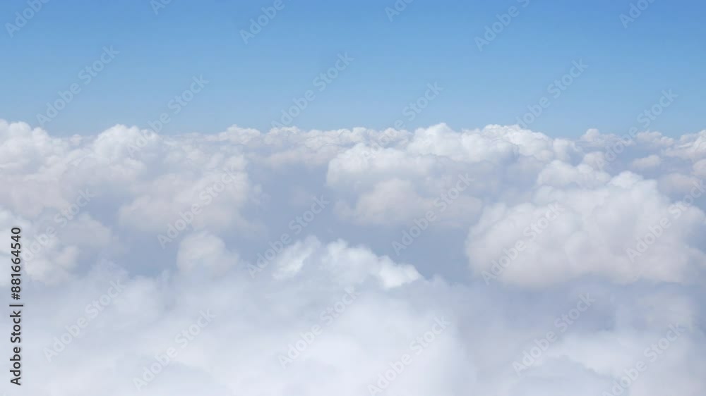 Aerial view above the clouds and sky inspiration concept in cinematic breathtaking aerial flying over white fluffy cloudscape in high altitude sky with fresh clean air and blue skies on background. Aerial view above the clouds and sky inspiration concept in cinematic breathtaking aerial flying over white fluffy cloudscape in high altitude sky with fresh clean air and blue skies on background.