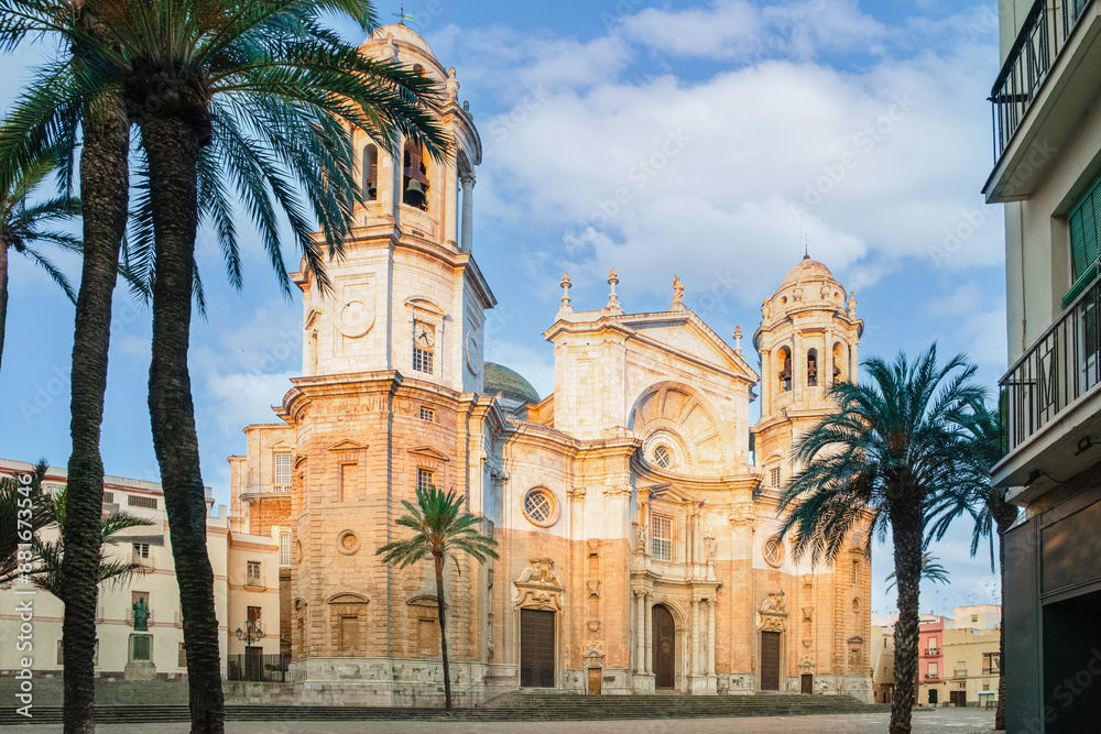 Cadiz Cathedral facade surrounded by palm trees in Andalusia, Sp Cadiz Cathedral facade surrounded by palm trees in Andalusia, Sp