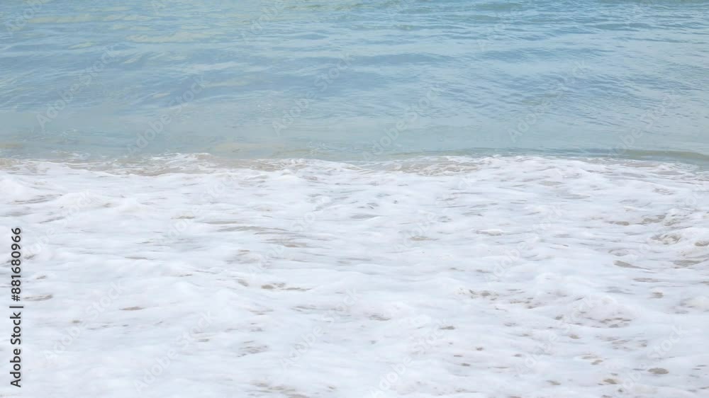 view to summer sea water wave while hitting white sand natural beach with water splash in foaming, white sand beach and foaming waves crushing against coast line at Phuket Phanga Beach in Thailand. view to summer sea water wave while hitting white sand natural beach with water splash in foaming, white sand beach and foaming waves crushing against coast line at Phuket Phanga Beach in Thailand.