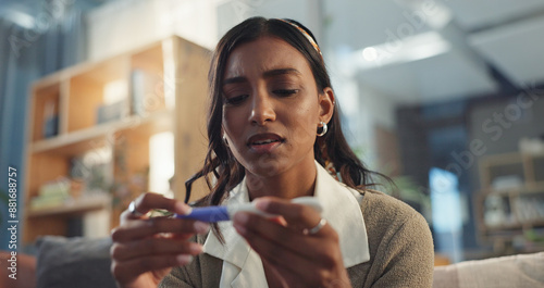 Photography Girl, home and sad with pregnancy test on couch for negative results on ovulation stick, unhappy and fertility concern