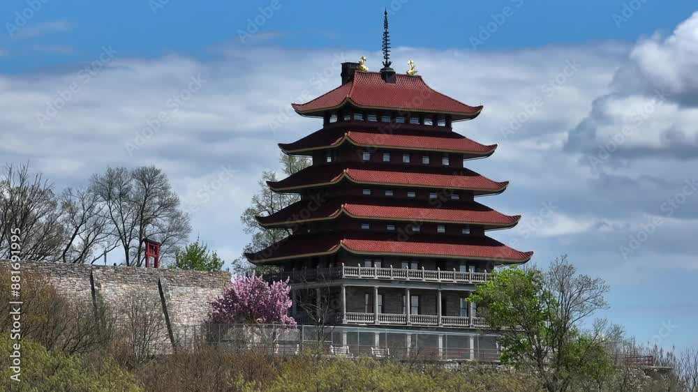 The Pagoda Building on Mount Penn Top during sunny day in Reading, PA, USA. Spring Season with Asian architecture. Aerial zoom approaching shot. The Pagoda Building on Mount Penn Top during sunny day in Reading, PA, USA. Spring Season with Asian architecture. Aerial zoom approaching shot.
