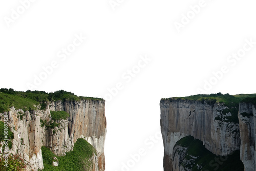 Steep cliffs on both sides with a gap in the middle. Isolated from the white background.
