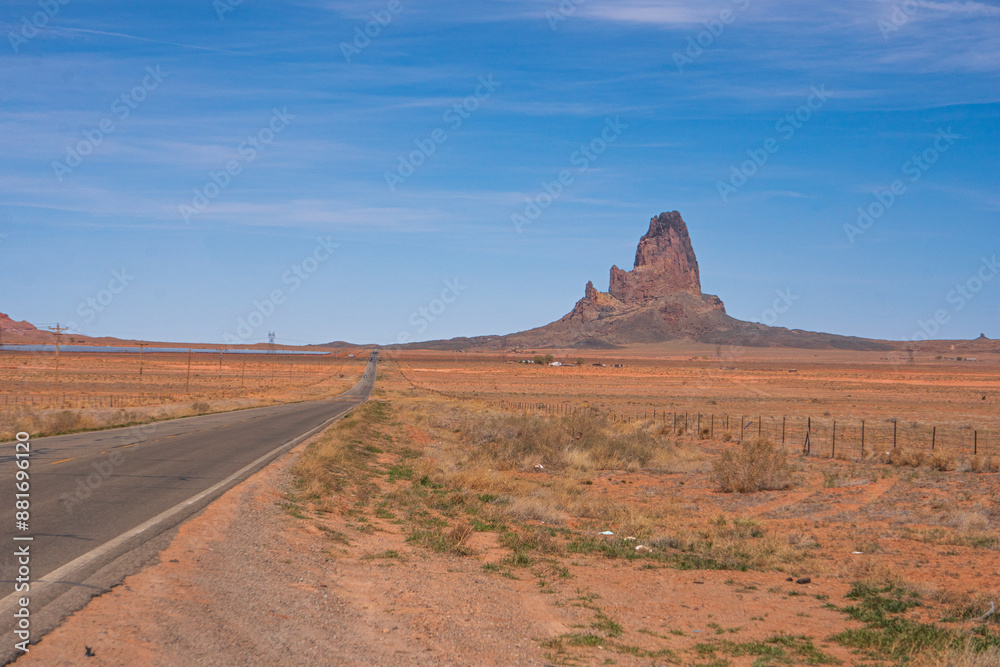 Empty road in southern Utah, with trash thrown in nature next to it. Concept of pollution from cars Empty road in southern Utah, with trash thrown in nature next to it. Concept of pollution from cars