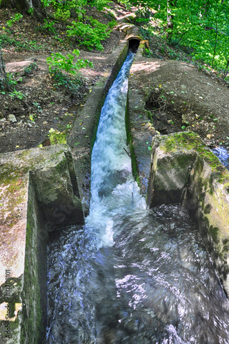 Water stream flowing into the forest in Yedi Goller (Seven Lakes) National Park, Bolu, Turkey photo