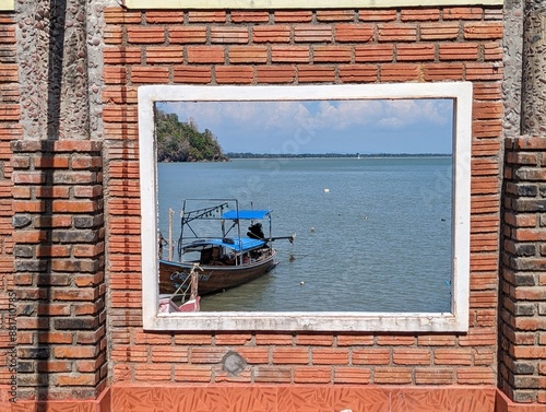 Sea view through a window from abandoned house in Phuket, Thailand 
