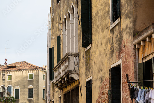 Windows and balcony of houses in Venice