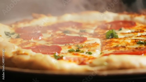 Close-up view of freshly baked pepperoni pizza with melting cheese