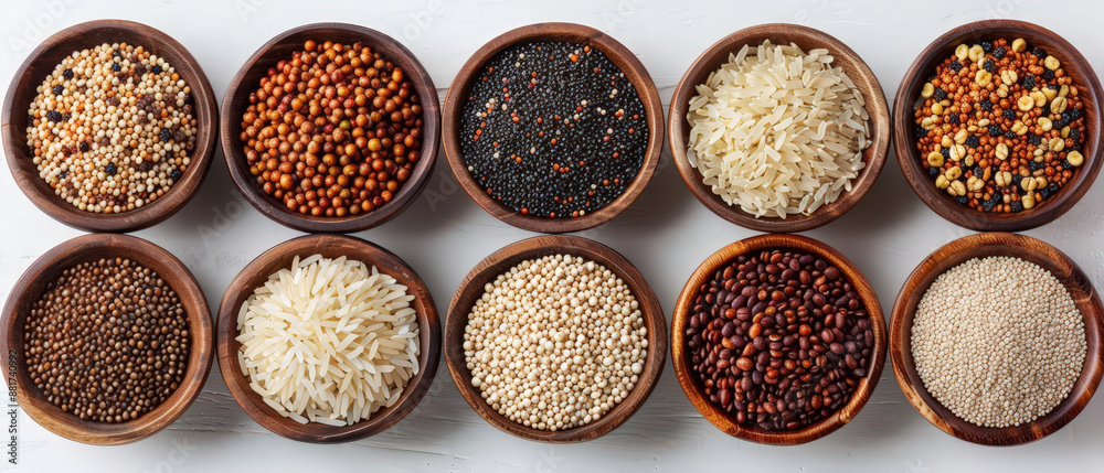 Assorted grains and seeds in wooden bowls, displaying a variety of colors and textures, ideal for culinary and natural food themes. Assorted grains and seeds in wooden bowls, displaying a variety of colors and textures, ideal for culinary and natural food themes.