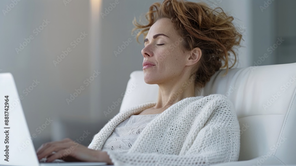 Side profile of a mid-aged woman practicing progressive muscle relaxation techniques to release tension at her office desk, serene office setting. Side profile of a mid-aged woman practicing progressive muscle relaxation techniques to release tension at her office desk, serene office setting.