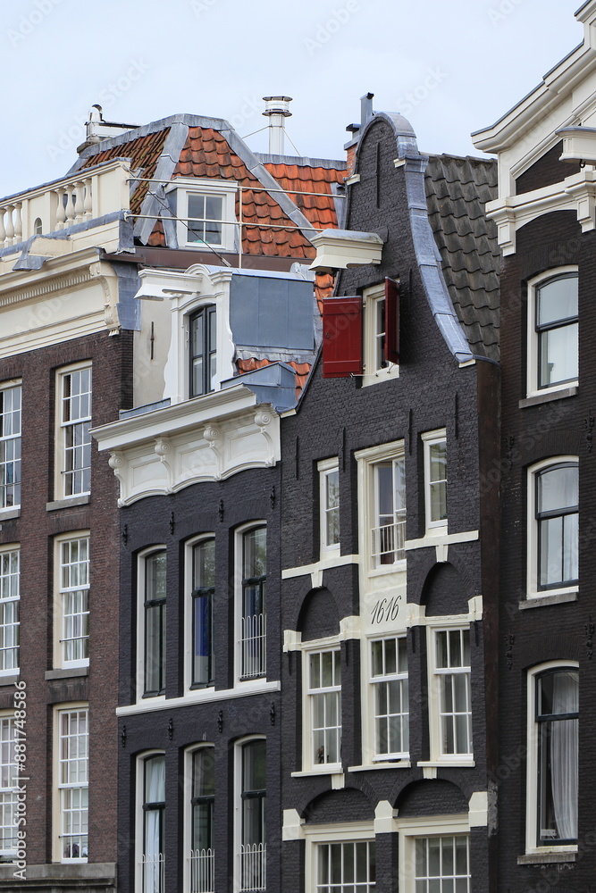 Fototapeta premium Amsterdam Brouwersgracht Canal House with Clock Gable and Red Wooden Shutter, Netherlands