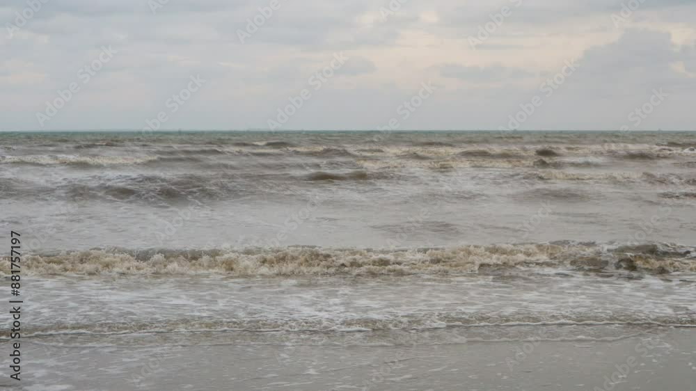 View of the waves rising to the surface of the white sandy beach