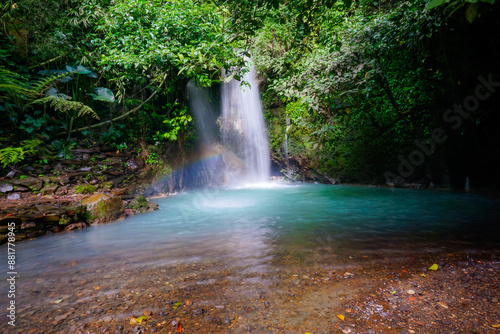 Beautiful waterfalls with blue water in the tropical forest. Curug Cipondok west java Subang Indonesia. Tranquil nature scenery for wallpaper background.  photo