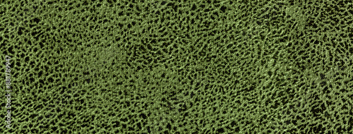 Dark green abstract background from soft upholstery textile material, closeup. Texture velvet olive fabric.