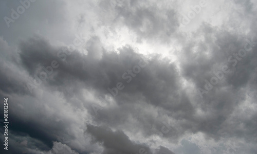 Stormy clouds background. Dark grey sky before the rain. Grey texture. Gray cloudy sky. Thunder sky.