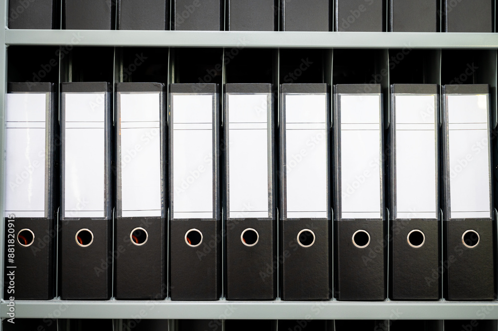 Many documents organized in row on office shelf, Folders binders. Many documents organized in row on office shelf, Folders binders.