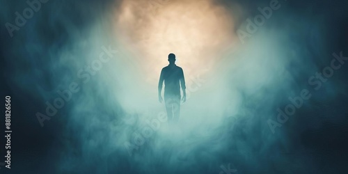 Silhouette of a person walking towards light in a foggy atmosphere, representing mystery and enlightenment.