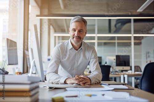 It’s about adapting your ideas to drive innovation Shot of a businessman in casual clothes working in his office photo