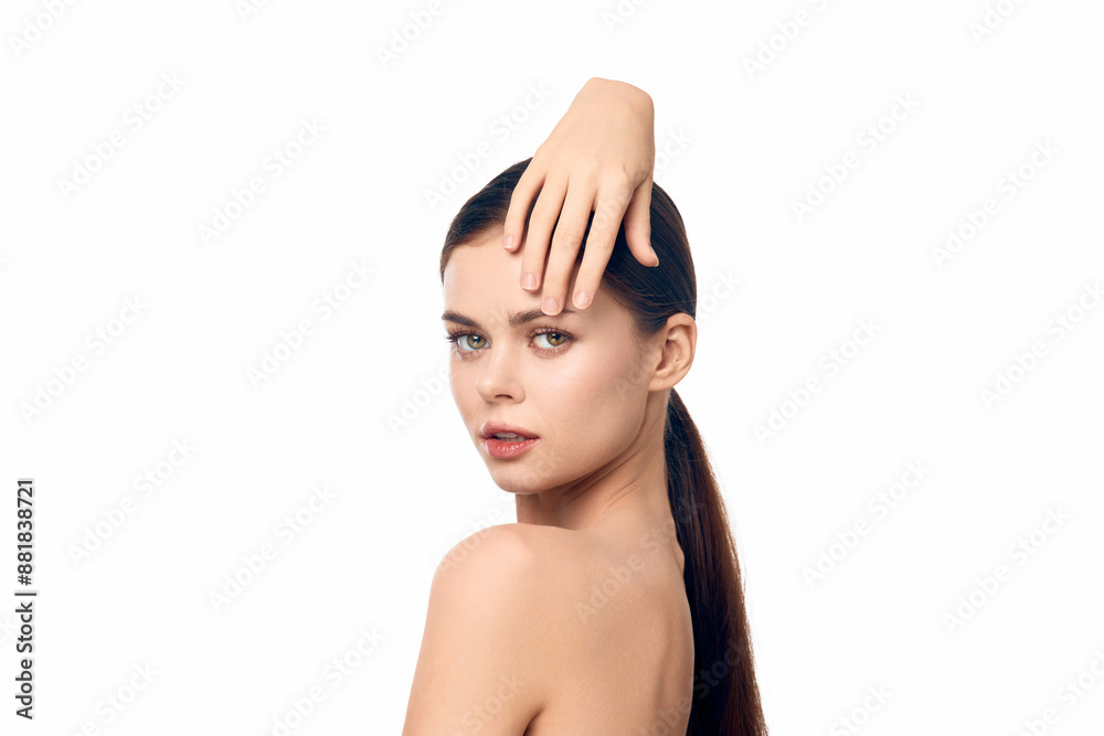 Beautiful woman with long hair holding hand to face on a white background Beautiful woman with long hair holding hand to face on a white background