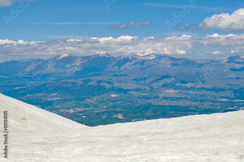 Monte Sirente (Italy) - The landscape summit of Mount Sirente, one of the highest peaks of the Apennines mountain in Abruzzo region, with snow and hiker. photo