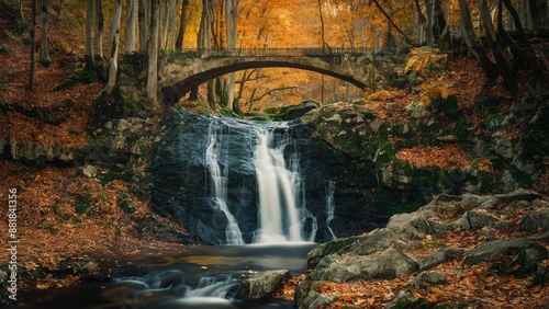 Amidst the vibrant hues of autumn, a serene waterfall cascades down, creating a symphony of sound and sight