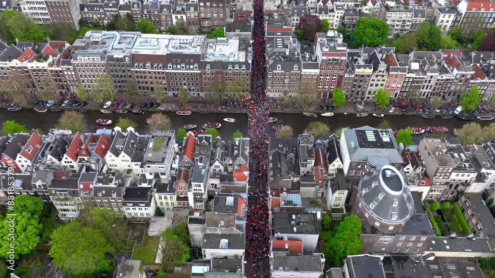 Kings Day 2024 in Amsterdam. Koningsdag, Koeningsdag in Capital of the Netherlands, Aerial Drone Fly Over Orange Suits.