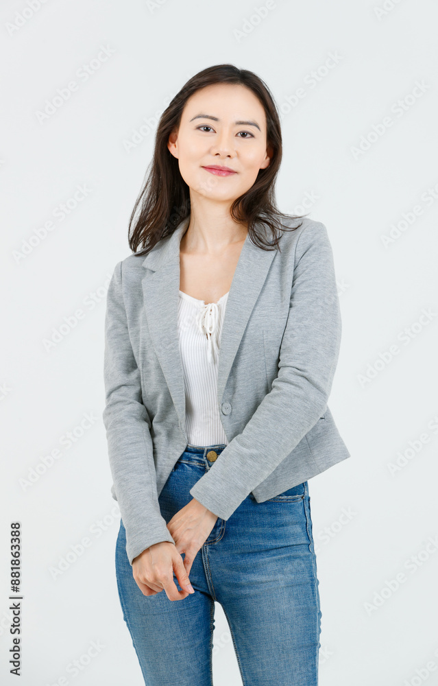Asian female attractive smiling happy cheerful successful employee businesswoman, she wearing casual classic blazer and standing on white background isolated studio portrait. Lifestyle concept. Asian female attractive smiling happy cheerful successful employee businesswoman, she wearing casual classic blazer and standing on white background isolated studio portrait. Lifestyle concept.