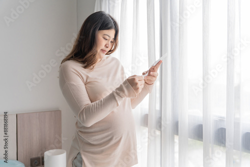 Pregnant asian woman holding  ultrasound baby Image Result from Doctor. Happy mom health care concept