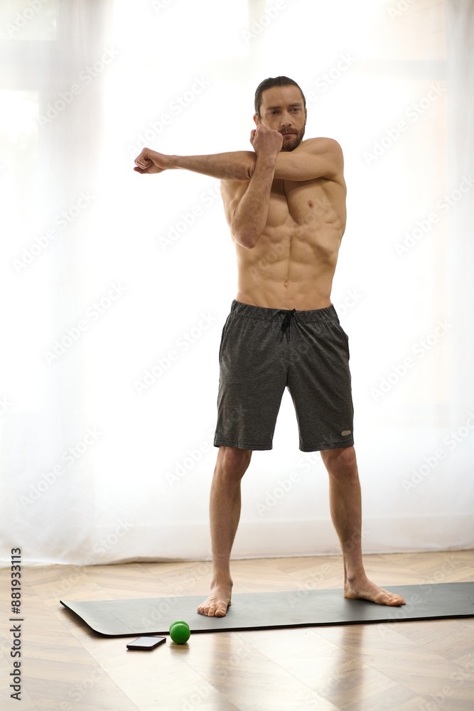 Fototapeta premium A man standing gracefully on a yoga mat, finding balance and peace at home.