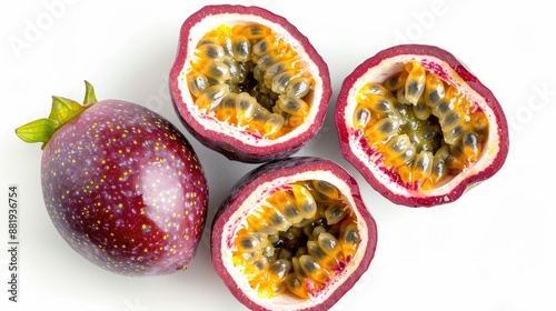 Top view of whole and sliced passion fruits, highlighting the vibrant pulp, against a white background