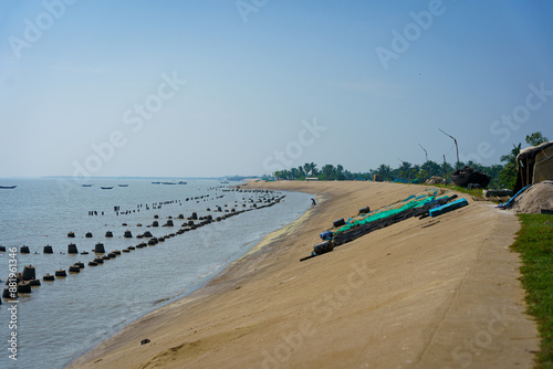 Embankments on the of indian Sundarbans to protetect the land from coastal erosion rising sea levels due to climate change on the coast of India. photo