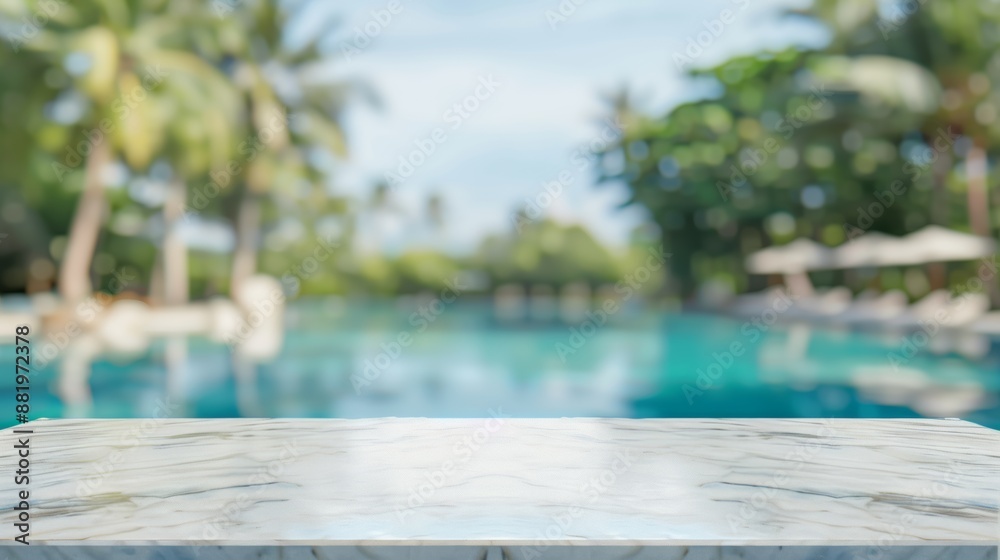 Fototapeta premium Empty white stone marble table and blurred swimming pool in the tropical resort in the summer banner background