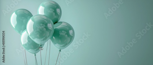 Teal Balloons Floating Against a Mint Green Background