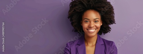 Smiling Woman With Curly Hair Posing Against Purple Background
