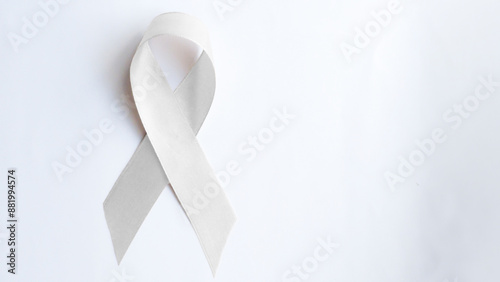 A White light pearl color ribbon for Lung cancer awareness and Multiple Sclerosis, symbol for international day of non-violence, cancer disease treatment of disease control