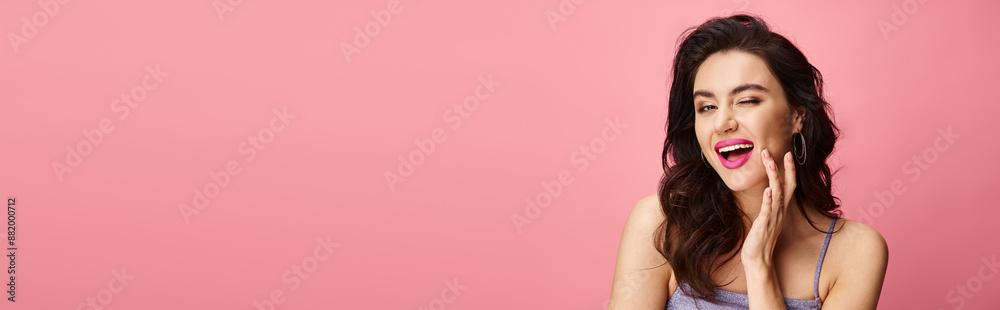 An attractive woman shows surprise on a vibrant backdrop. An attractive woman shows surprise on a vibrant backdrop.