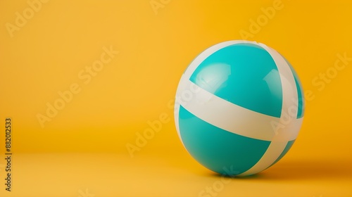 Turquoise and White Beach Ball on a yellow Background. Summer Wallpaper