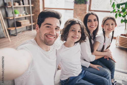 Photo of adorable charming mom dad children wear casual outfits recroding self video indoors room home house