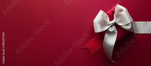 Single Red Gift Box With White Ribbon Bow on Red Background