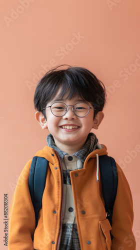6 years old Asian Japanese schoolboy looking at camera