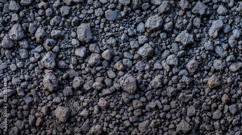 Close-up of a textured, rocky surface displaying an intricate pattern of dark, rough stones. Perfect for a background or geological study. Close-up of a textured, rocky surface displaying an intricate pattern of dark, rough stones. Perfect for a background or geological study.
