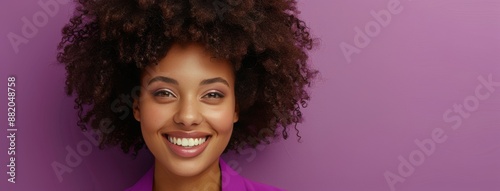 Smiling Woman With Curly Hair Against Purple Background