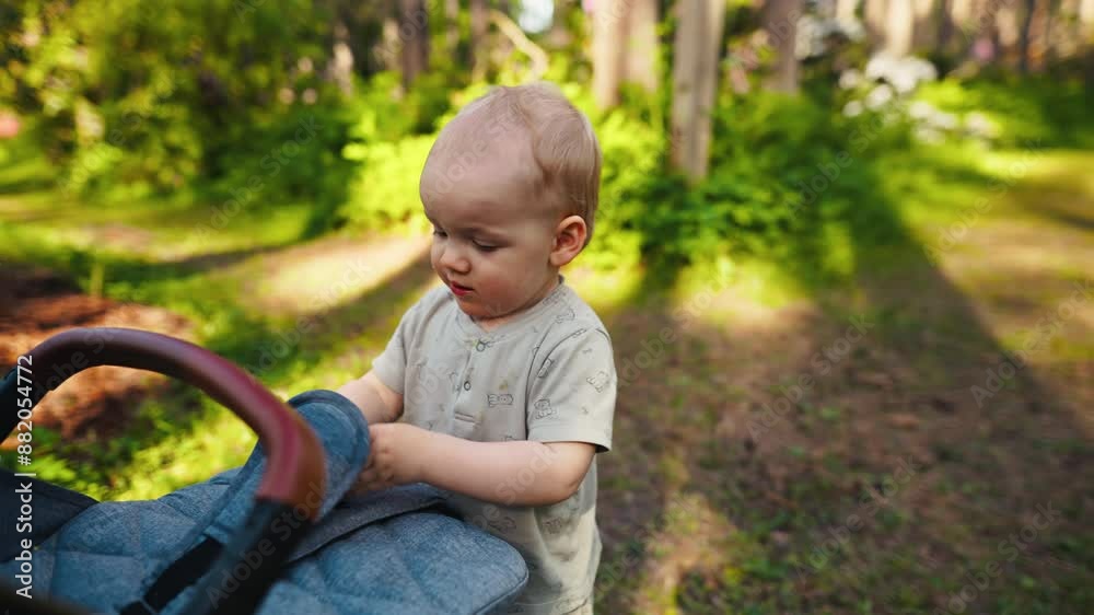 Capturing a charming moment of a delightful baby exploring outdoors in a sunny park filled with greenery and sunshine Capturing a charming moment of a delightful baby exploring outdoors in a sunny park filled with greenery and sunshine