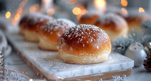 Deliciously Glazed Buns With Powdered Sugar on a White Surface