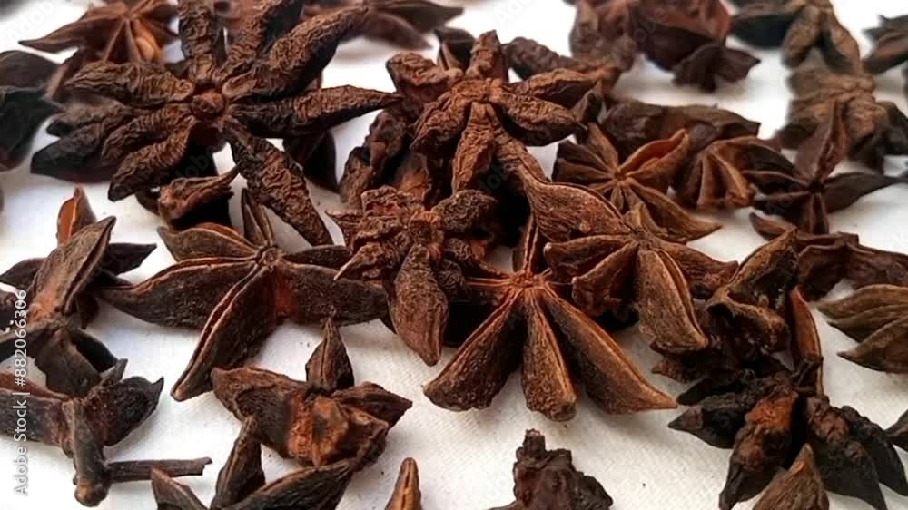 Star anise fall on rotating full frame background, micro shot, spinning, herbs and spices Star anise fall on rotating full frame background, micro shot, spinning, herbs and spices