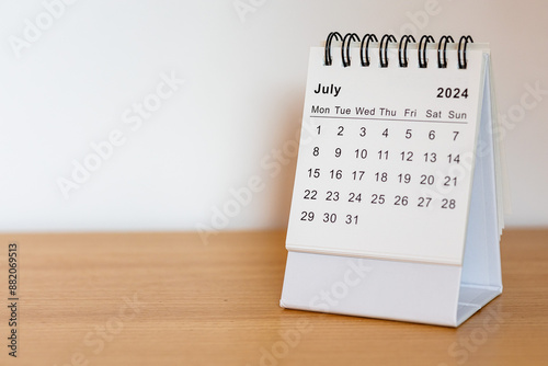 2024 calendar - July month page on the wooden desk