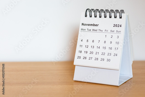 2024 calendar - November month page on the wooden desk