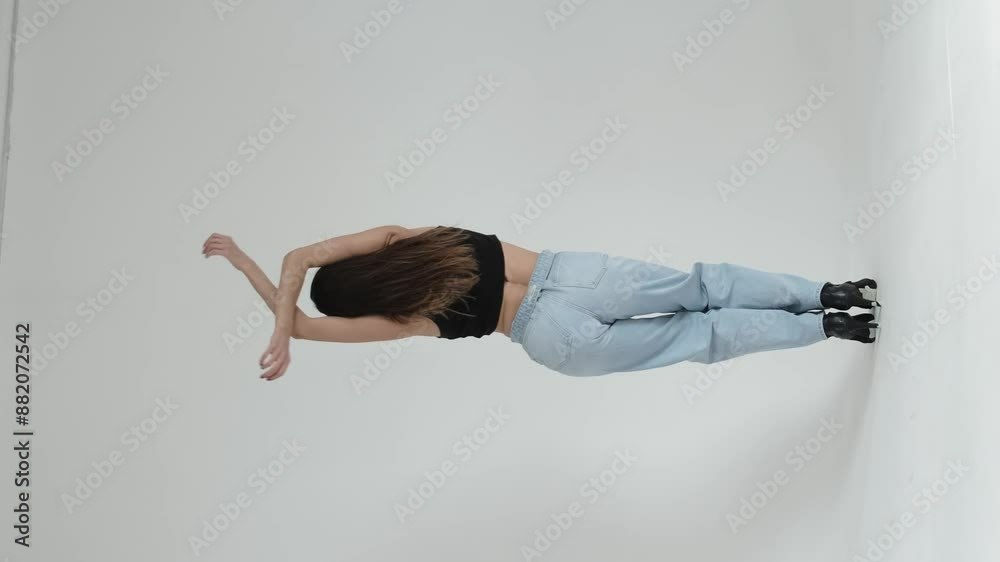 middle-aged woman dancing gracefully in a minimalist studio, arms extended in fluid motion. Concept: Emphasizing the beauty of self-expression and the joy of movement at any age, promoting physical